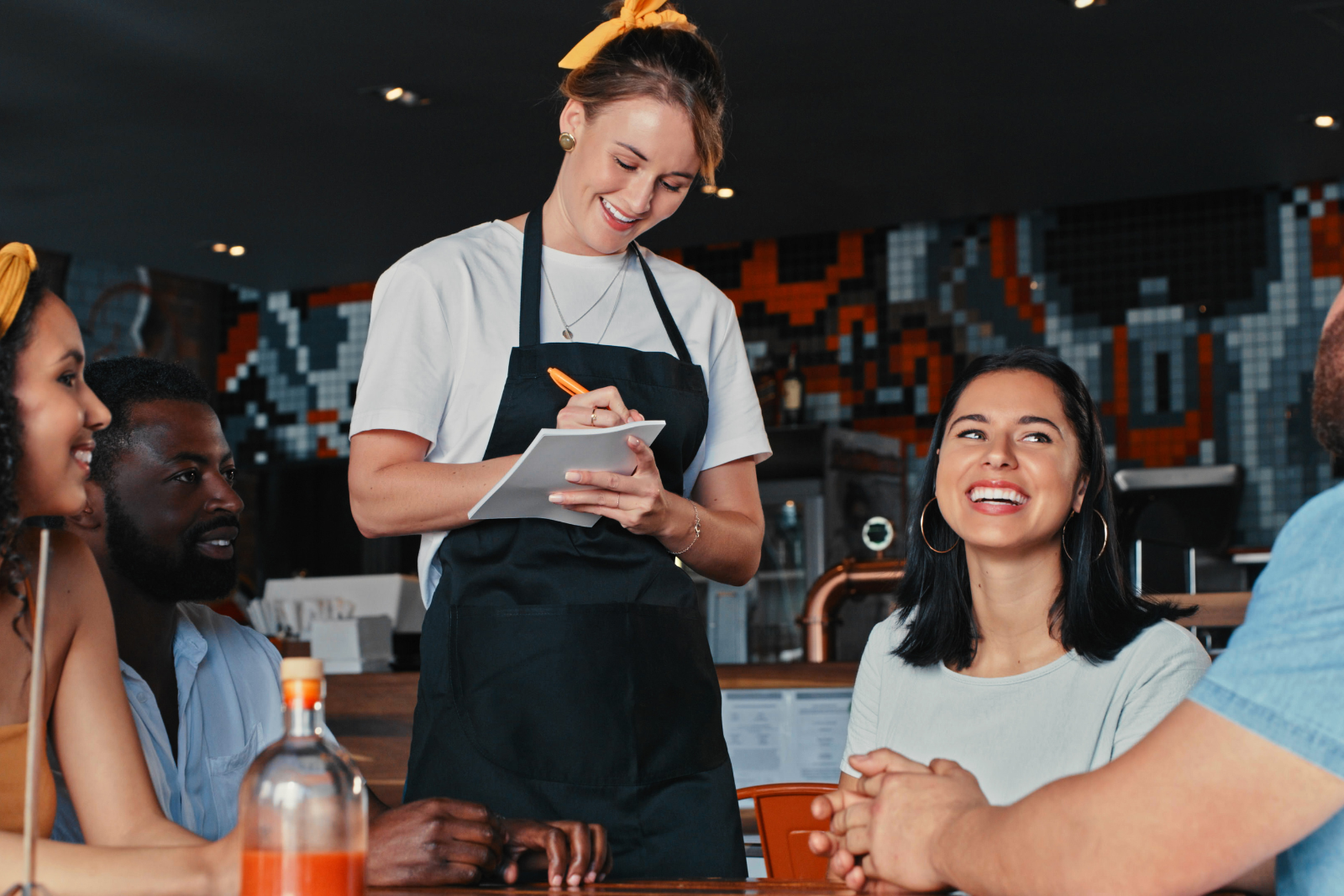 a waitress serving customers at a seasonal restaurant