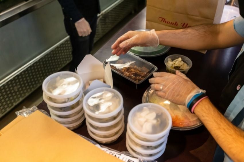 Food handler preparing a takeout order