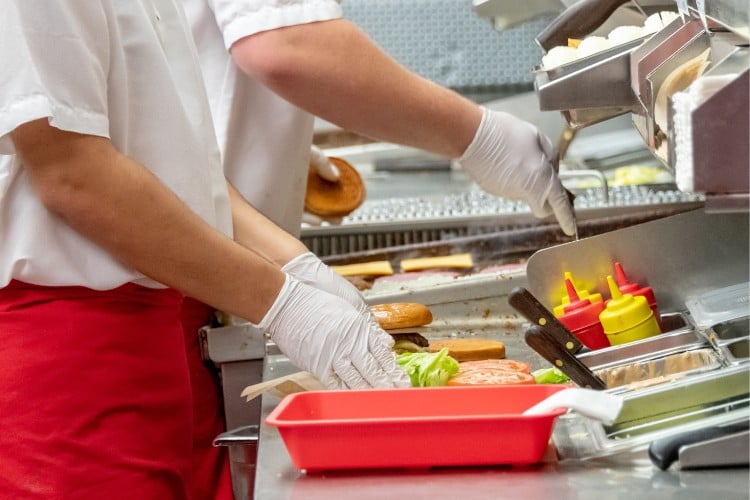 Preparing food according to food safety standards.