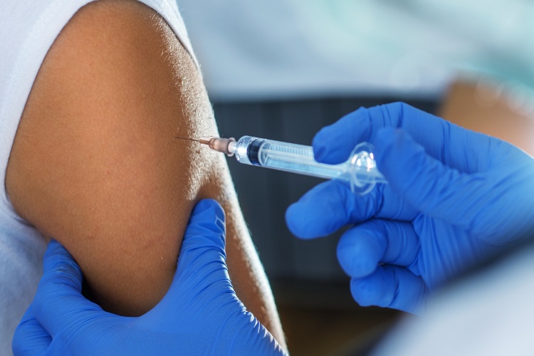 Foodservice employee getting a vaccine